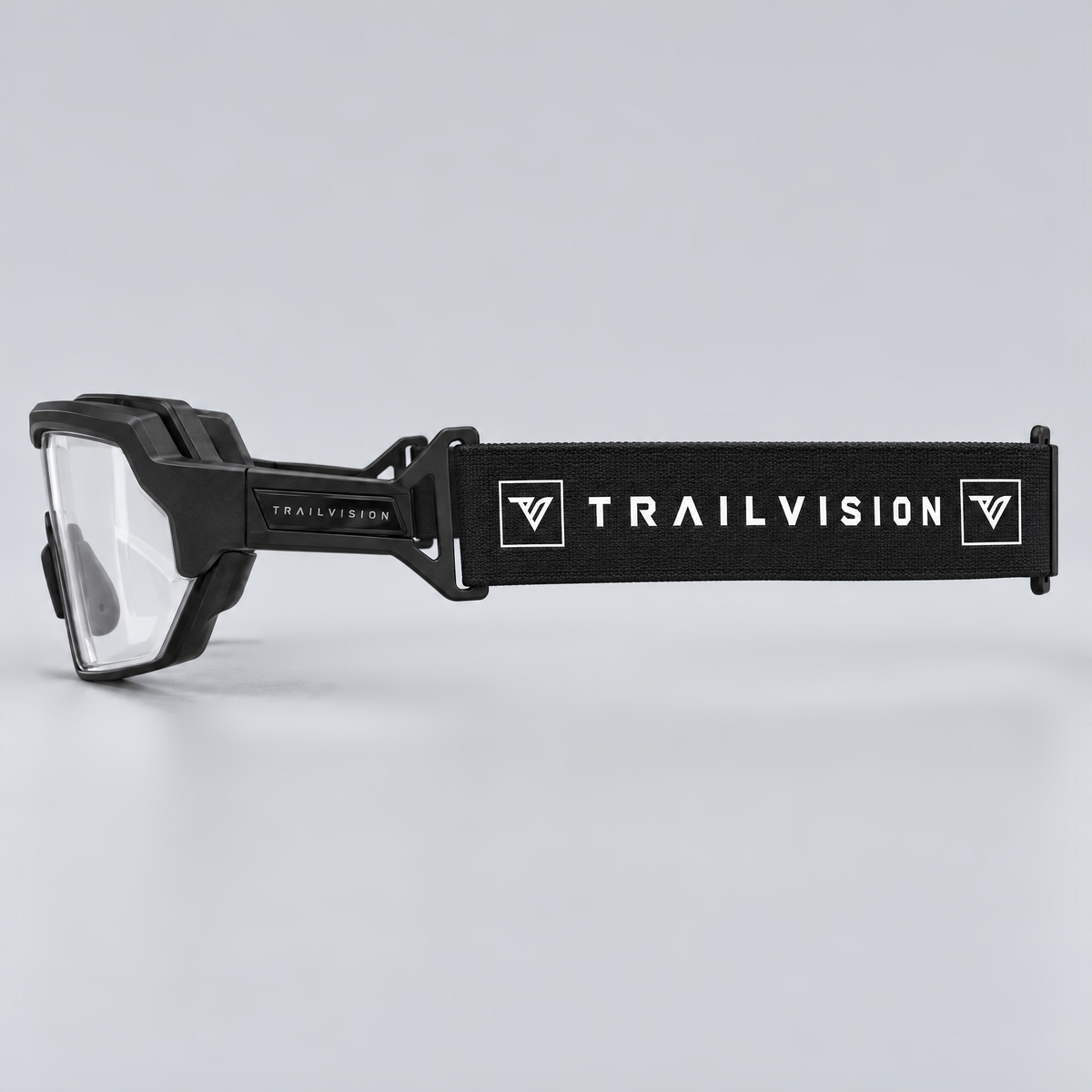 Titan side profile with the black elastic TRAILVISION strap attached to the temple clips