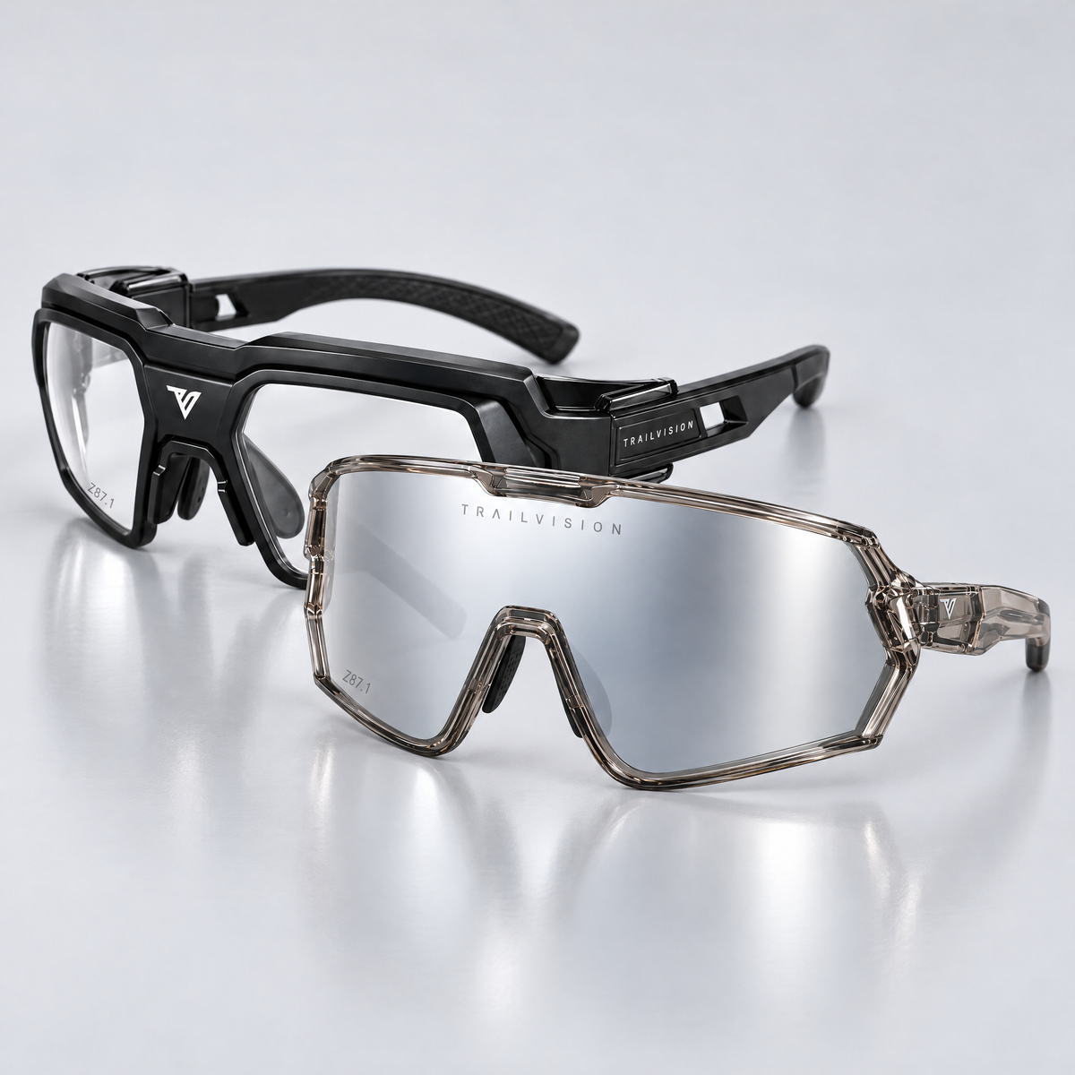Trailvision Safety Duo: Bastion photochromic shield and Titan clear-lens safety glasses on a studio floor
