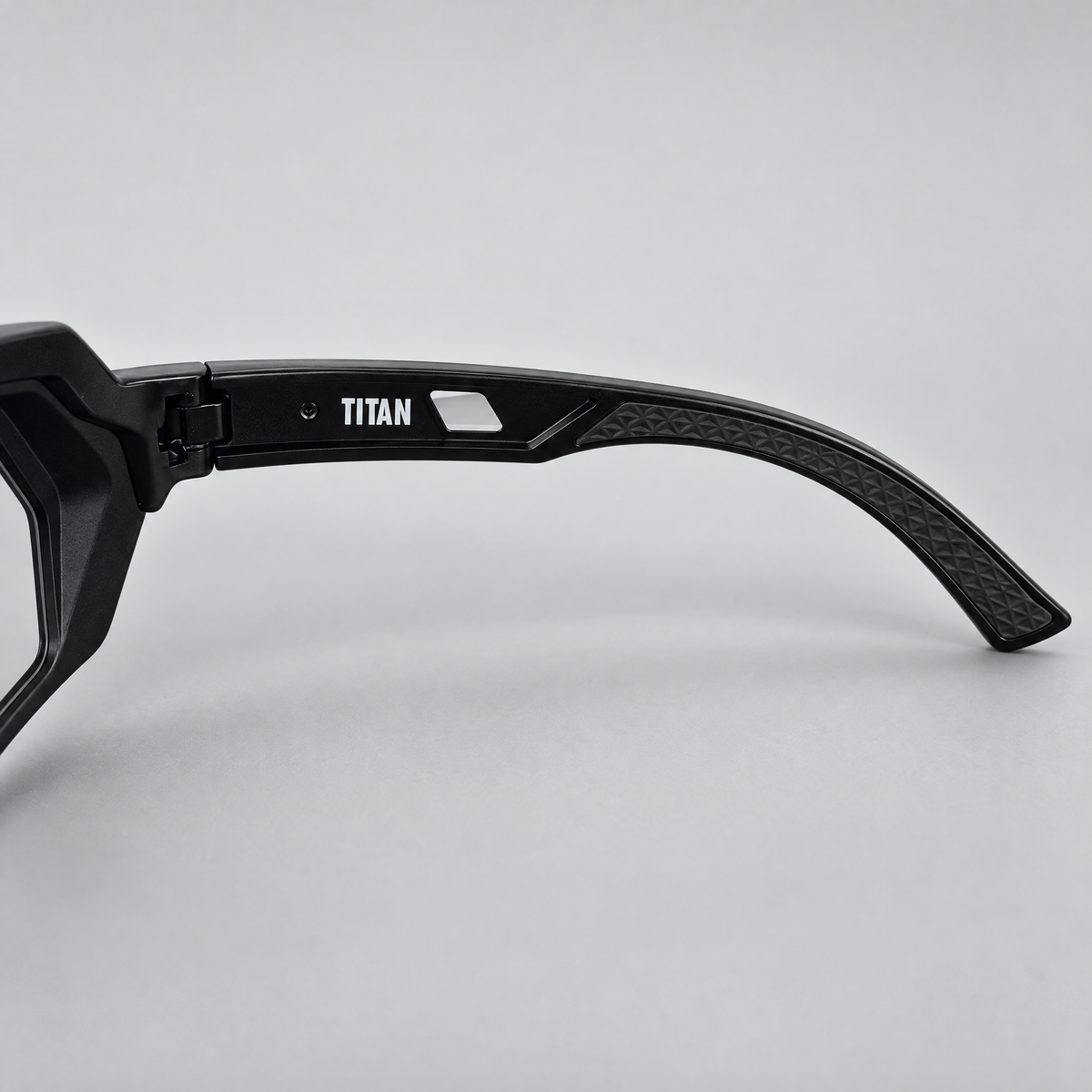 Titan inner temple with white TITAN lettering and textured rubber grip tip