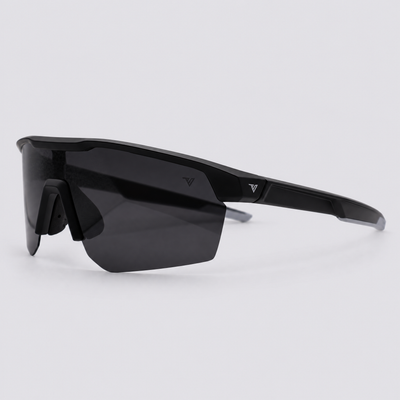 Trailvision Velocity sunglasses, Matte Black frame with grey temple tips and a polarized Smoke shield lens, angle view